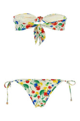 Colorful bikini set with cherry pattern on a white background